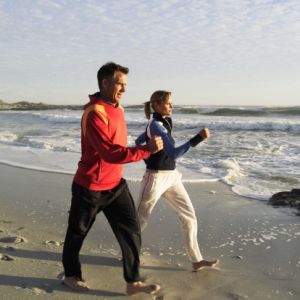 Couple jogging at the beach