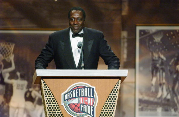 Meadowlark Lemon stands at the podium