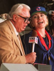 U.S. First Lady Hillary Rodham Clinton (R) sings '