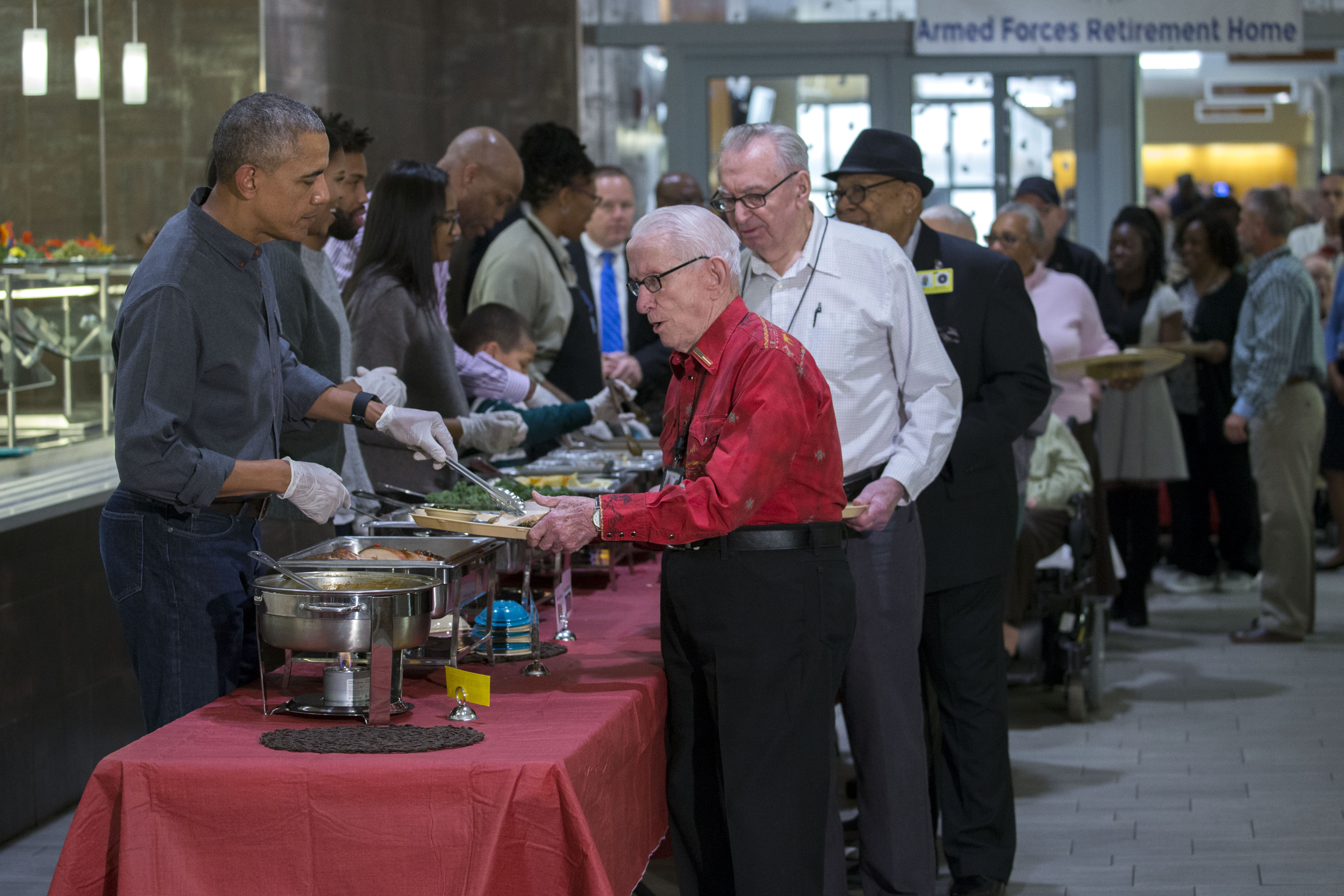 US President Barack Obama Serves Dinner At The Armed Forces Retirement Home