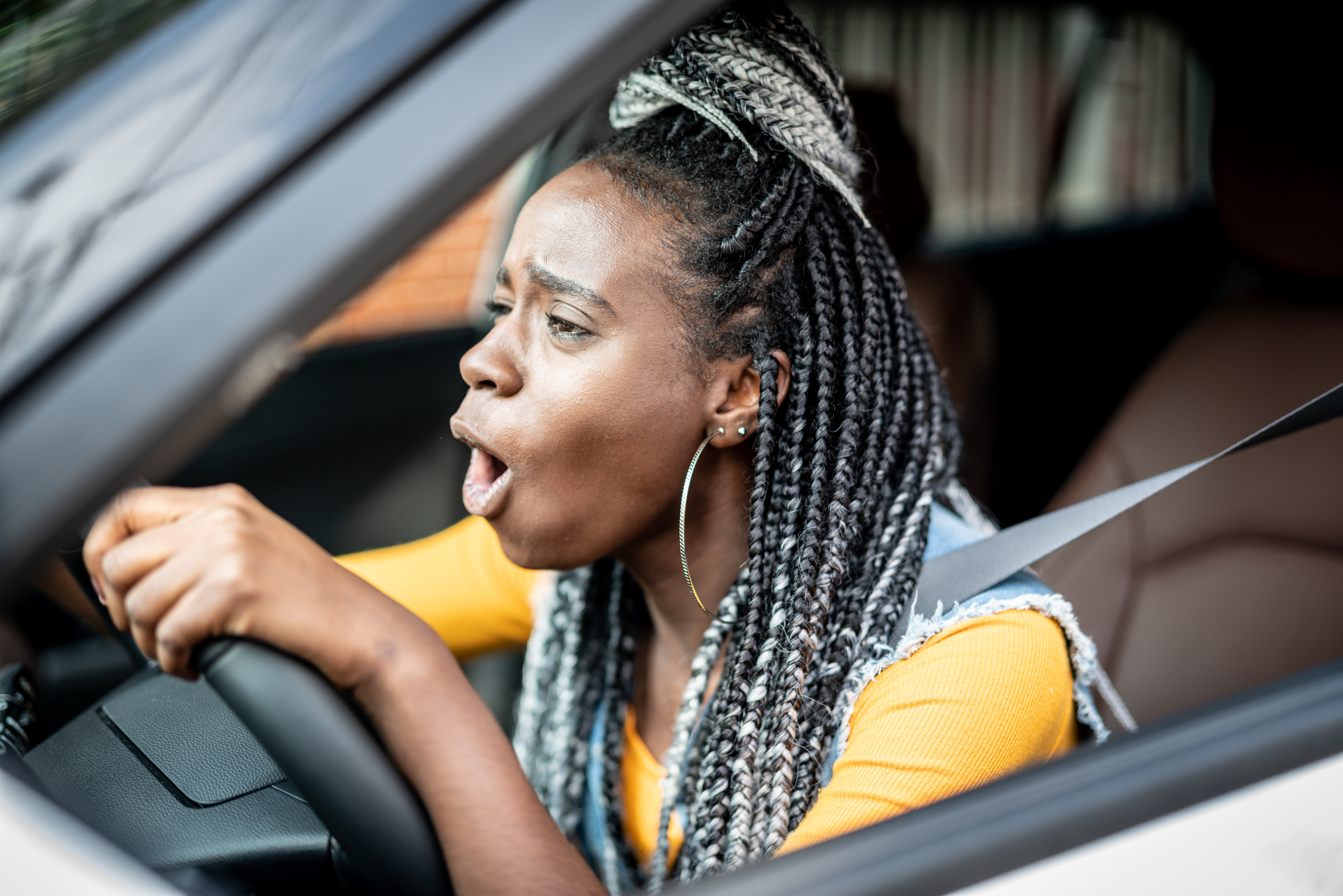 Portrait of Stressed African Woman In Car