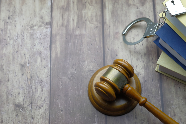 top view of gavel and handcuff with copy space