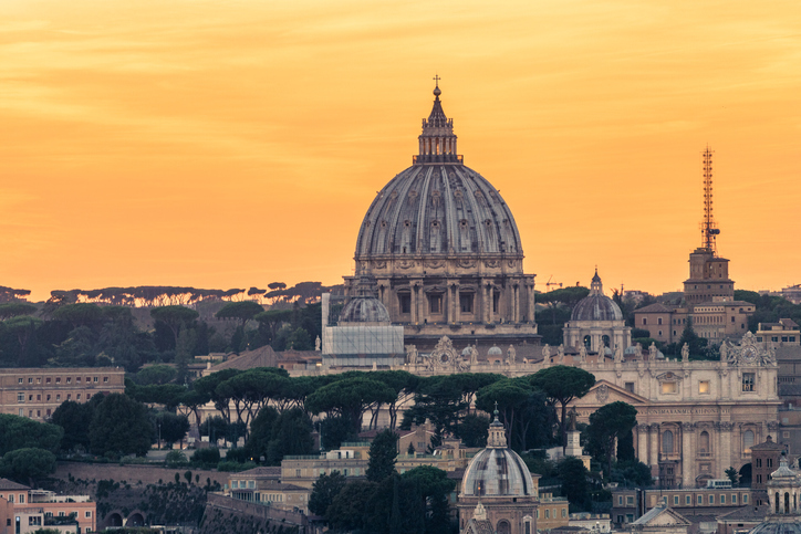 St Peters Basilica and skyline with church cupolas, Vatican, Rome, Italy (Sunset)