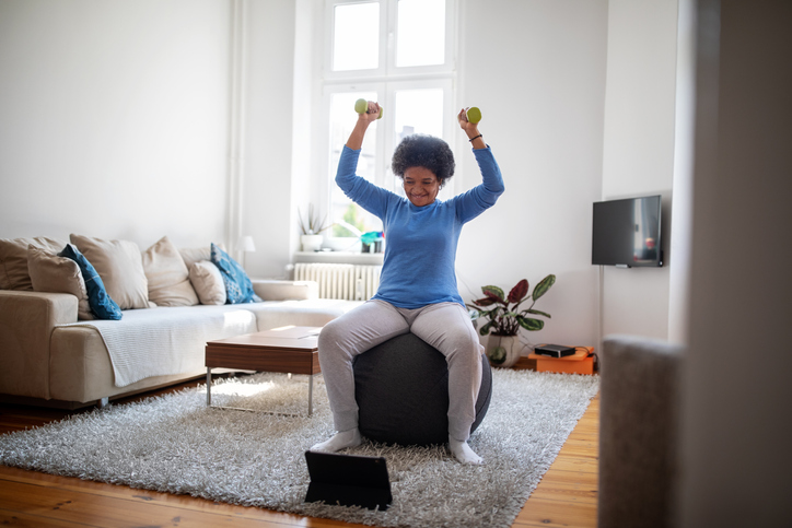 Woman is doing online workout during covid-19 lockdown