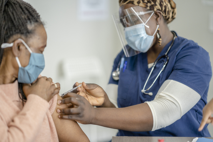 Senior African Woman Receiving the COVID-19 Vaccine Medical Injection