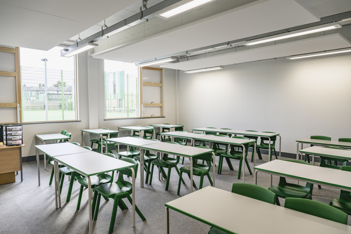 Secondary school classroom with desks and chairs