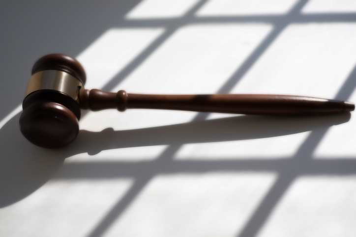 judge’s traditional wooden gavel on white background & shadow detail