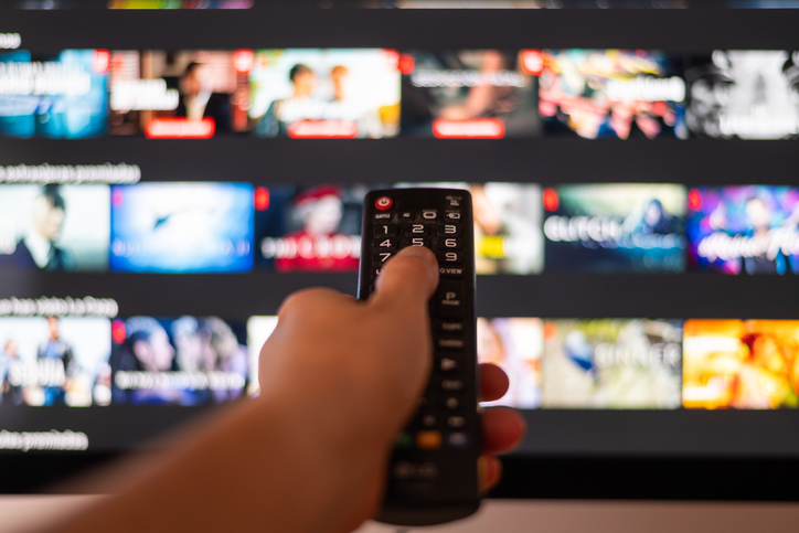 Hand Using A Television Remote Control.