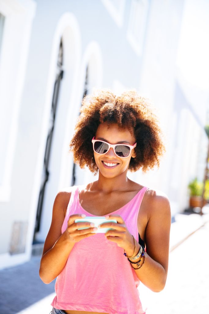 Girl texting in the streets