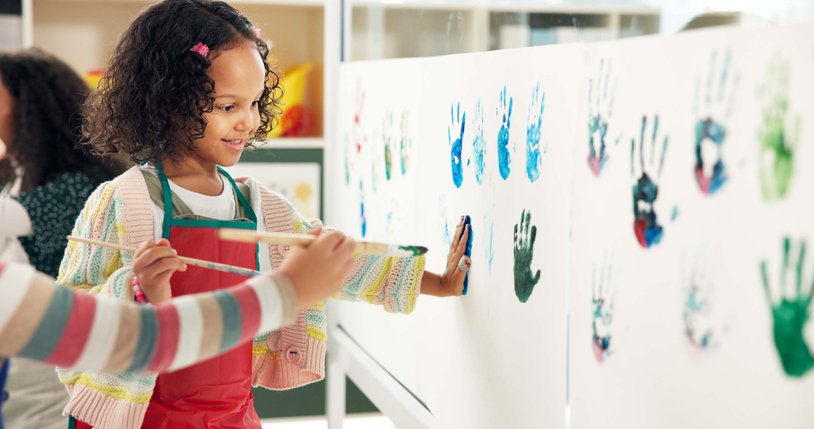 School, painting and children with handprint on paper for creative lesson, education and development. Classroom, students and kids with colors for fun activity, artistic project and motor skills